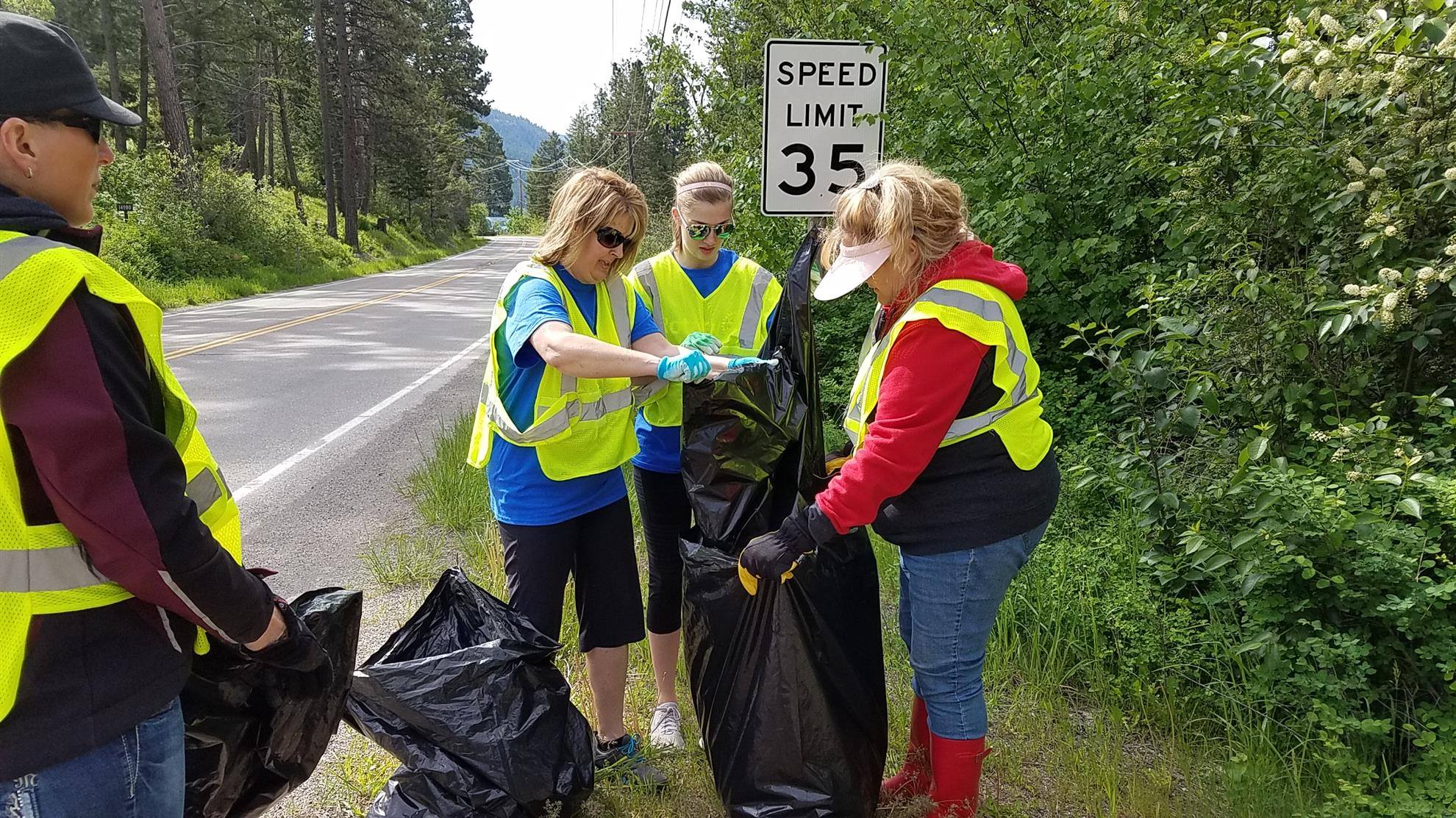 Volunteers gathering litter on highway