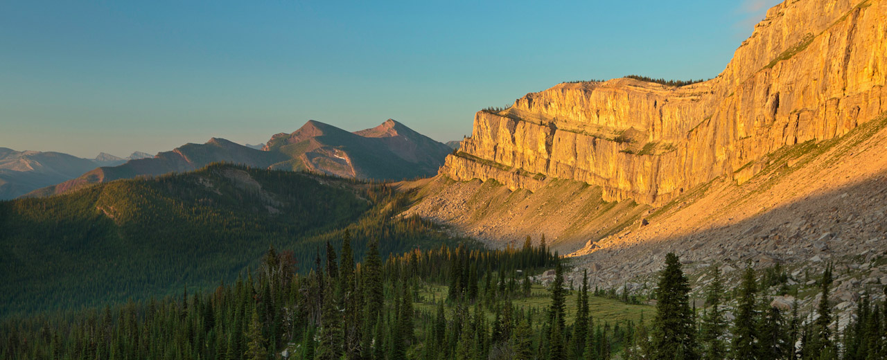 Cliff Mountain and Cliff Pass which is part of the Chinese Wall at sunrise in the Bob Marshall Wilderness in Montana. USA.