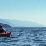 Man kayaking on Flathead Lake