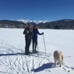 Couple cross country skiing on Flathead Lake Northshore.