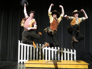 Cowboys jumping in the air 