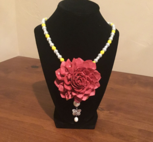 Necklace with large pink flower and pearls 